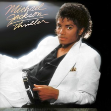 The cover has Jackson reclining in a white suit