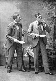 Two young white men in a garden, standing and eating muffins, about which they bicker